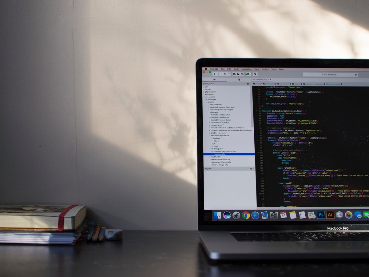 MacBook with book for new Gatsby site